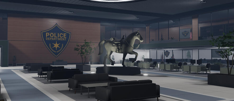Police headquarters lobby with a central horse sculpture, seating and wood-paneled walls